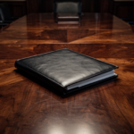 A leather dossier on a mahogany table representing the sovereign family office and its absolute financial secrecy.